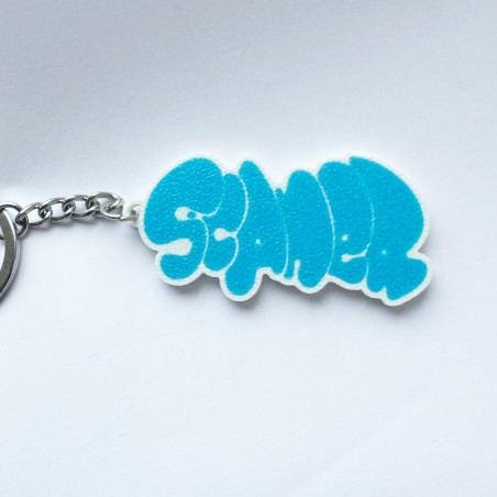 Llavero azul con diseño del escritor de graffiti Scaner