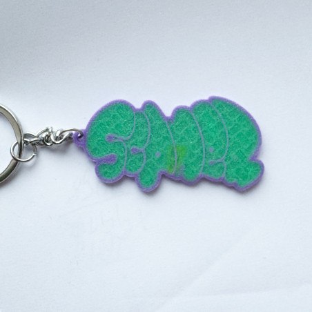 Llavero verde con diseño del escritor de graffiti Scaner