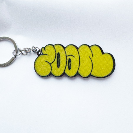 Llavero amarillo con diseño del escritor de graffiti Zoan